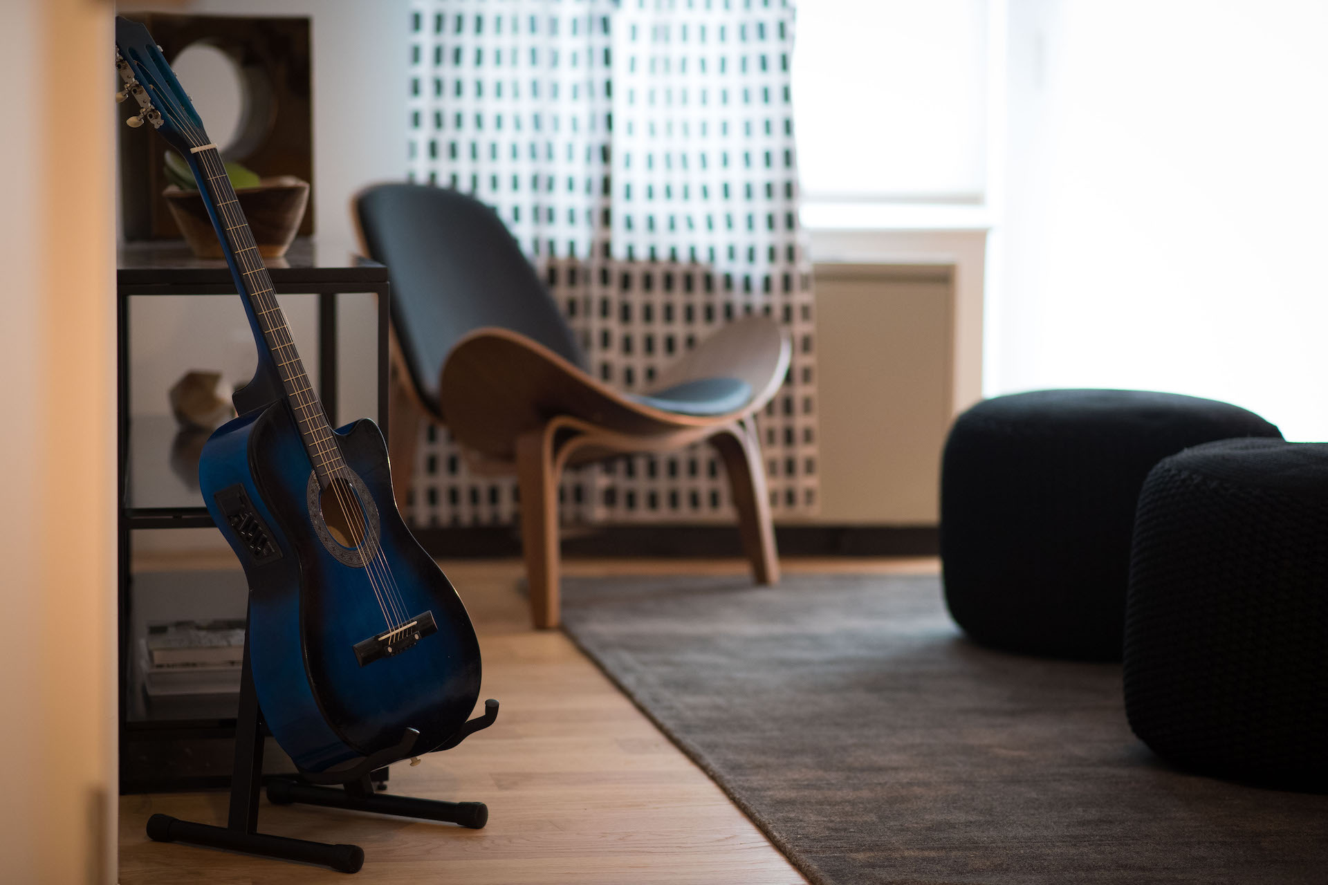 A guitar sits in a living area at The Vitagraph Apartments in Brooklyn