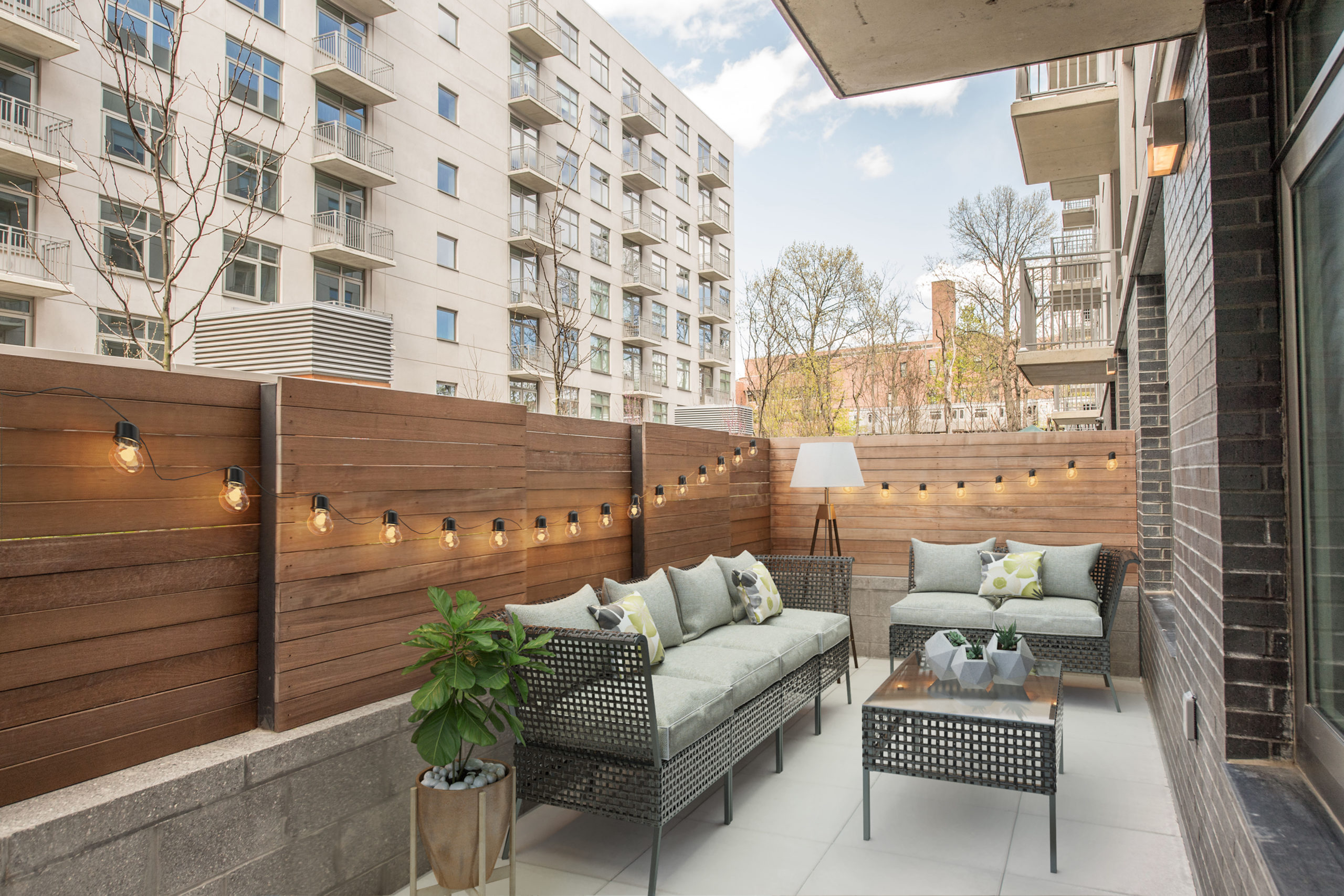 Outdoor patio at The Vitagraph Brooklyn with wicker furniture